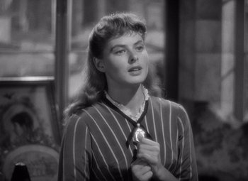 Movie still from “Gaslight” (1944), directed by George Cukor – A black - and - white photo of a woman in a striped shirt; Close Up shot, Over the shoulder angle