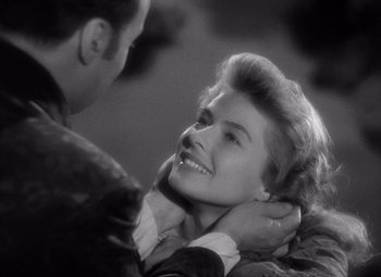 Movie still from “Gaslight” (1944), directed by George Cukor – A man and a woman smiling at each other; Close Up shot, Over the shoulder angle