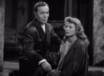 Movie still from “Gaslight” (1944), directed by George Cukor – A man and a woman are standing next to each other; Medium shot, Over the shoulder angle