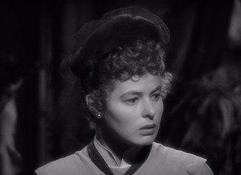 Movie still from “Gaslight” (1944), directed by George Cukor – A black and white photo of a woman with a hat; Close Up shot, High angle
