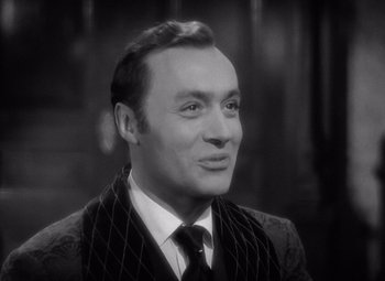 Movie still from “Gaslight” (1944), directed by George Cukor – An older man in a suit and tie; Close Up shot, High angle