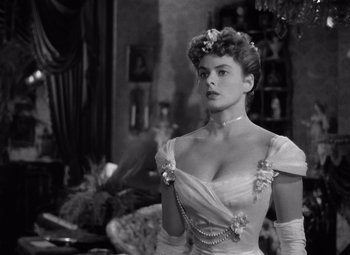 Movie still from “Gaslight” (1944), directed by George Cukor – A black and white photo of a woman in a dress; Close Up shot, Over the shoulder angle