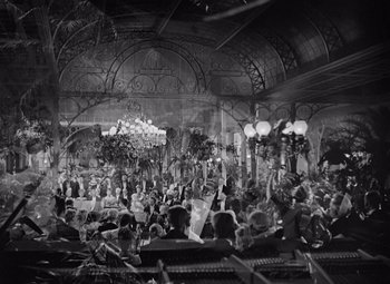 Movie still from “Gaslight” (1944), directed by George Cukor – A large group of people gathered in an ornate room; Extreme Wide shot, High angle