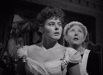 Movie still from “Gaslight” (1944), directed by George Cukor – Two women in old - fashioned dresses looking up; Close Up shot, Low angle