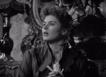 Movie still from “Gaslight” (1944), directed by George Cukor – An old photo of a woman in a victorian dress; Close Up shot, Low angle