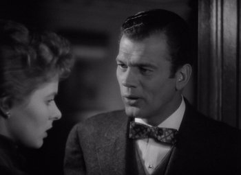 Movie still from “Gaslight” (1944), directed by George Cukor – A black and white photo of a man and a woman; Close Up shot, Over the shoulder angle