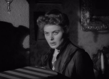 Movie still from “Gaslight” (1944), directed by George Cukor – A black - and - white photo of a woman in a room; Close Up shot, Low angle
