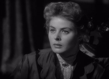 Movie still from “Gaslight” (1944), directed by George Cukor – A black - and - white photo of a woman in a suit; Close Up shot, Over the shoulder angle