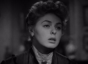 Movie still from “Gaslight” (1944), directed by George Cukor – A black - and - white photo of a woman in a dress; Close Up shot, Low angle