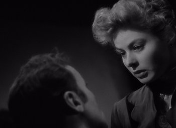 Movie still from “Gaslight” (1944), directed by George Cukor – An old photo of a man and a woman; Close Up shot, Low angle