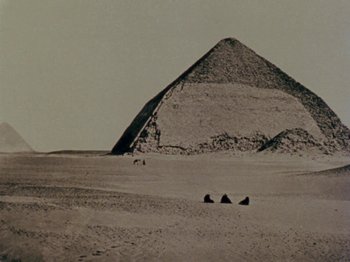 Movie still from “Gates of Heaven” (1978), directed by Errol Morris – A pyramid in the middle of the desert; Extreme Wide shot, Low angle