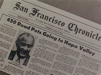 Movie still from “Gates of Heaven” (1978), directed by Errol Morris – The front page of the san francisco chronicle; Extreme Close Up shot, High angle