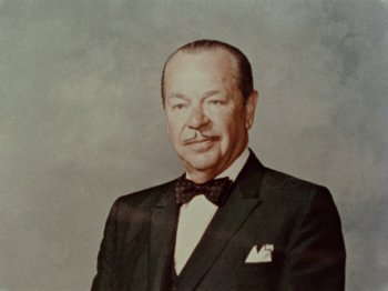 Movie still from “Gates of Heaven” (1978), directed by Errol Morris – An older man wearing a suit and bow tie; Close Up shot, Low angle