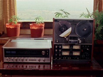 Movie still from “Gates of Heaven” (1978), directed by Errol Morris – Two tape recorders are sitting next to each other on a table; Extreme Close Up shot, High angle
