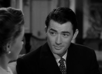 Movie still from “Gentleman's Agreement” (1947), directed by Elia Kazan – A black and white photo of a man in a suit; Close Up shot, Over the shoulder angle