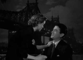 Movie still from “Gentleman's Agreement” (1947), directed by Elia Kazan – A man and a woman are smiling at each other; Medium shot, Over the shoulder angle