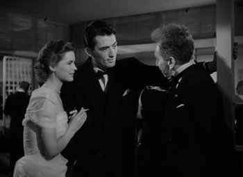 Movie still from “Gentleman's Agreement” (1947), directed by Elia Kazan – A man and a woman are talking to another man in a suit; Medium shot, Over the shoulder angle
