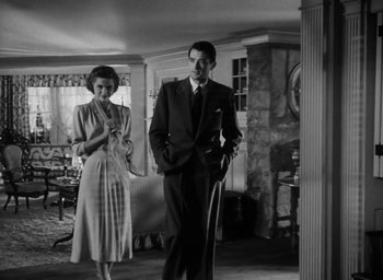 Movie still from “Gentleman's Agreement” (1947), directed by Elia Kazan – A man and a woman standing in a living room; Wide shot, Low angle