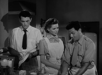 Movie still from “Gentleman's Agreement” (1947), directed by Elia Kazan – A man and a woman and a man and a woman standing in a kitchen; Medium shot, Low angle