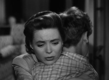 Movie still from “Gentleman's Agreement” (1947), directed by Elia Kazan – An old photo of a woman and a man hugging; Close Up shot, Over the shoulder angle