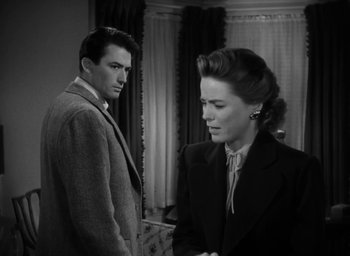 Movie still from “Gentleman's Agreement” (1947), directed by Elia Kazan – A man and a woman standing next to each other in a room; Medium shot, Over the shoulder angle