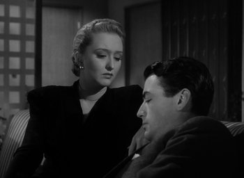 Movie still from “Gentleman's Agreement” (1947), directed by Elia Kazan – A man and a woman are looking at each other; Close Up shot, High angle