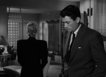 Movie still from “Gentleman's Agreement” (1947), directed by Elia Kazan – A black and white photo of a man and a woman; Medium shot, Low angle