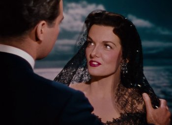 Movie still from “Gentlemen Prefer Blondes” (1953), directed by Howard Hawks – A man and a woman are looking at one another; Close Up shot, Over the shoulder angle