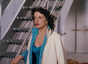 Movie still from “Gentlemen Prefer Blondes” (1953), directed by Howard Hawks – A woman in a blue dress and a white jacket; Medium shot, High angle