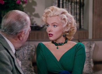 Movie still from “Gentlemen Prefer Blondes” (1953), directed by Howard Hawks – A man and a woman in a living room talking to each other; Medium shot, Over the shoulder angle