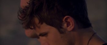 Movie still from “Gerry” (2002), directed by Gus Van Sant – A man's ear and face; Extreme Close Up shot, Over the shoulder angle