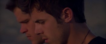 Movie still from “Gerry” (2002), directed by Gus Van Sant – A young man's face with his eyes closed; Close Up shot, Low angle