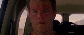 Movie still from “Gerry” (2002), directed by Gus Van Sant – A man's face in a vehicle; Close Up shot, Low angle