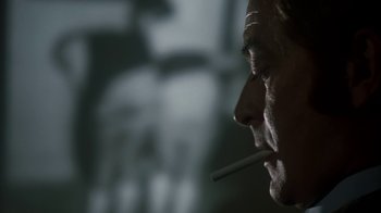 Movie still from “Get Carter” (1971), directed by Mike Hodges – A person with a cigarette in his mouth; Extreme Close Up shot, Low angle