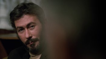Movie still from “Get Carter” (1971), directed by Mike Hodges – A person with a beard; Close Up shot, Over the shoulder angle