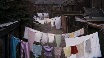 Movie still from “Get Carter” (1971), directed by Mike Hodges – Clothes are hanging on a clothesline in an alleyway; Extreme Wide shot, High angle