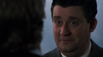 Movie still from “Get Carter” (1971), directed by Mike Hodges – A person looking at the camera; Close Up shot, Over the shoulder angle