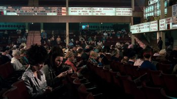 Movie still from “Get Carter” (1971), directed by Mike Hodges – A crowd of people sitting in a stadium; Extreme Wide shot, High angle