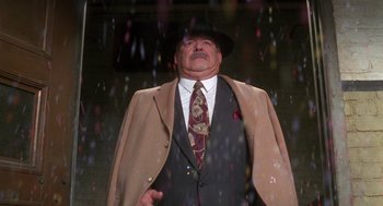 Movie still from “Get Shorty” (1995), directed by Barry Sonnenfeld – An older man in a suit and hat; Medium shot, Low angle