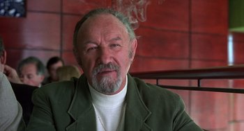 Movie still from “Get Shorty” (1995), directed by Barry Sonnenfeld – An older man with a beard and a green jacket; Close Up shot, Low angle
