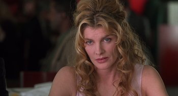 Movie still from “Get Shorty” (1995), directed by Barry Sonnenfeld – A person with long blonde hair; Close Up shot, Over the shoulder angle