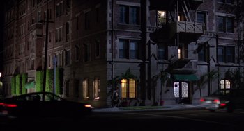 Movie still from “Get Shorty” (1995), directed by Barry Sonnenfeld – A person walking down a street at night; Extreme Wide shot, Low angle