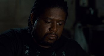 Movie still from “Ghost Dog: The Way of the Samurai” (1999), directed by Jim Jarmusch – A person with dreadlocks; Close Up shot, High angle