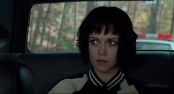 Movie still from “Ghost Dog: The Way of the Samurai” (1999), directed by Jim Jarmusch – A woman sitting in the back seat of a car; Close Up shot, Over the shoulder angle