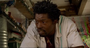 Movie still from “Ghost Dog: The Way of the Samurai” (1999), directed by Jim Jarmusch – A person wearing a jacket; Close Up shot, Low angle