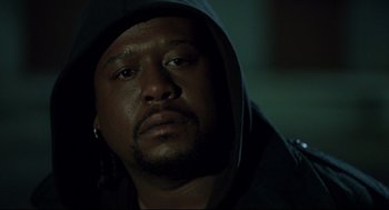 Movie still from “Ghost Dog: The Way of the Samurai” (1999), directed by Jim Jarmusch – A person wearing a hooded sweatshirt; Close Up shot, Low angle