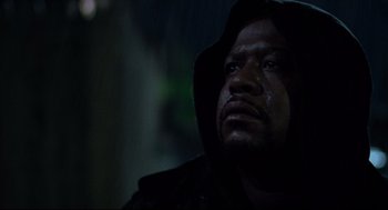 Movie still from “Ghost Dog: The Way of the Samurai” (1999), directed by Jim Jarmusch – A person wearing a hooded jacket; Close Up shot, Low angle