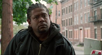 Movie still from “Ghost Dog: The Way of the Samurai” (1999), directed by Jim Jarmusch – A person wearing a jacket; Close Up shot, Over the shoulder angle