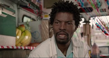 Movie still from “Ghost Dog: The Way of the Samurai” (1999), directed by Jim Jarmusch – A person wearing a white shirt; Close Up shot, Over the shoulder angle