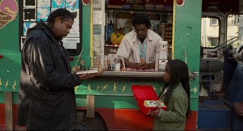 Movie still from “Ghost Dog: The Way of the Samurai” (1999), directed by Jim Jarmusch – A man and a woman standing in front of a food truck; Medium shot, Over the shoulder angle